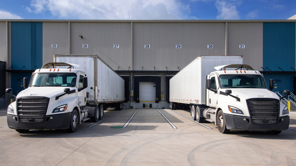 Two tractor trailers at loading docks