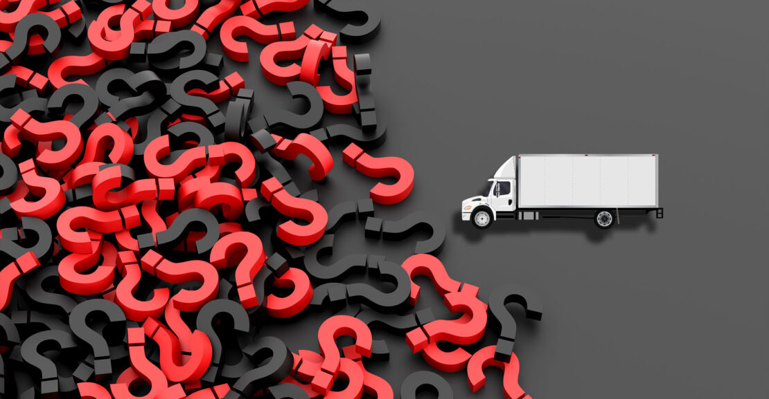 White commercial truck on black background filled with black and red question marks.