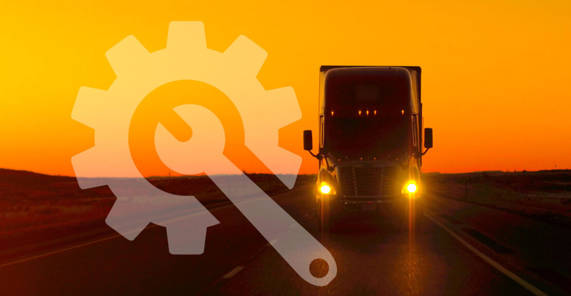 Semi truck driving directly into camera at golden sunset