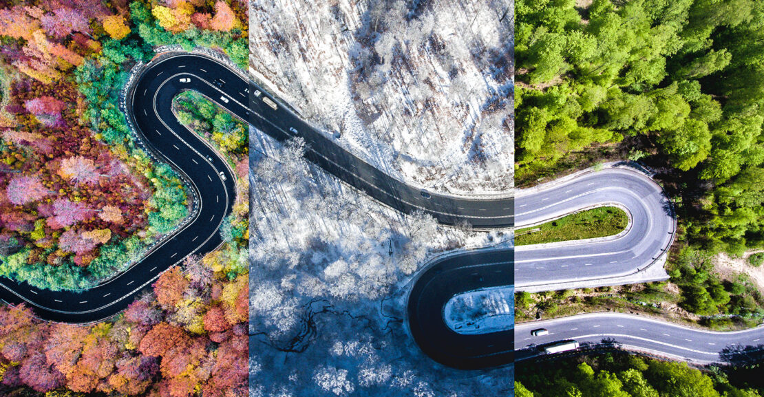 Winding road in the forest. Autumn, summer and winter time colage. Top down aerial view from a drone.