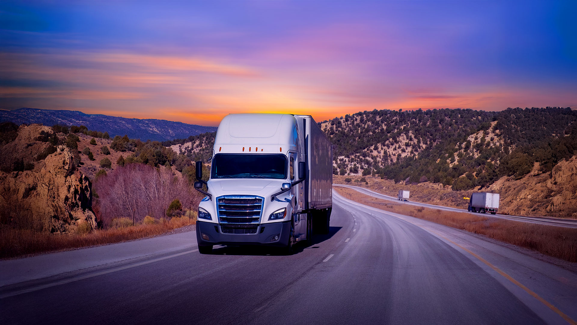White semi truck on highway in the southwest USA