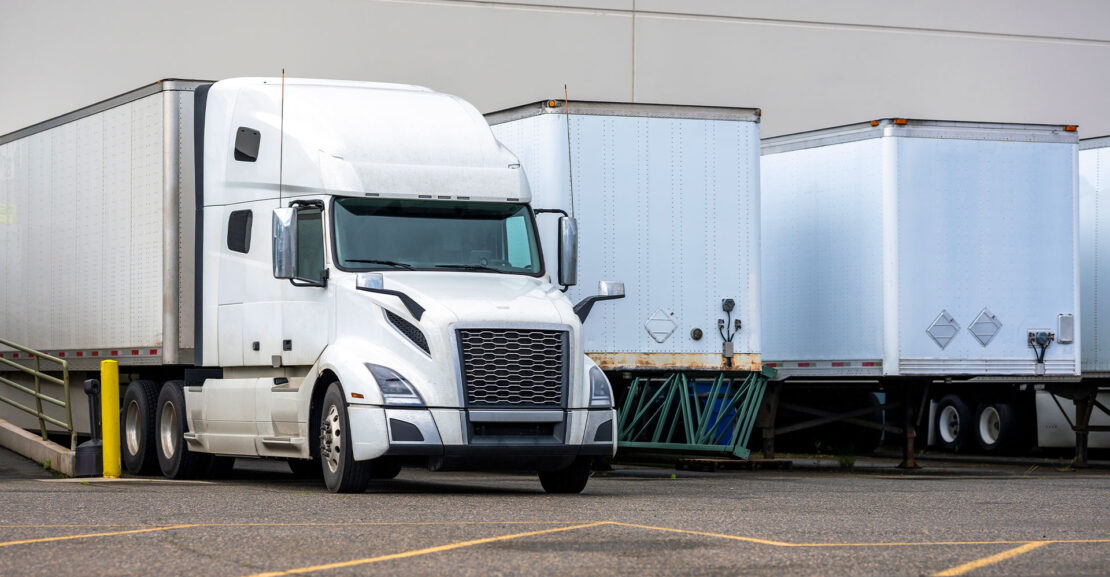 Semi truck and trailers at loading dock