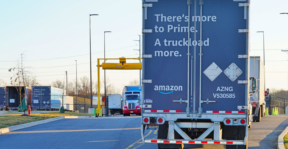 An Amazon Prime delivery tractor trailer truck entering an Amazon fulfillment distribution logistics facility